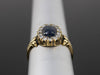 The Helena Midnight Blue Star Sapphire and Diamond Halo Ring in 18K Yellow Gold