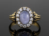 The Helena Misty Gray Star Sapphire and Diamond Halo Ring in 18K Yellow Gold