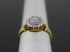 The Helena Misty Gray Star Sapphire and Diamond Halo Ring in 18K Yellow Gold